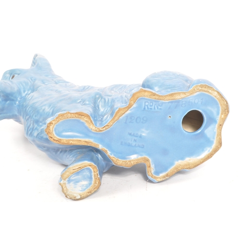 86 - Sylvac - A large fine bone china & ceramic seated dog animal figurines. In a blue colourway and mark... 