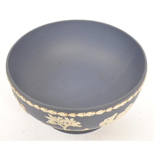 87 - An early 20th Century English antique ceramic Pedestal bowl by Josiah Wedgwood & Sons. Having blue a... 