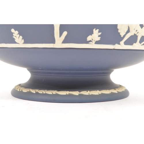 87 - An early 20th Century English antique ceramic Pedestal bowl by Josiah Wedgwood & Sons. Having blue a... 