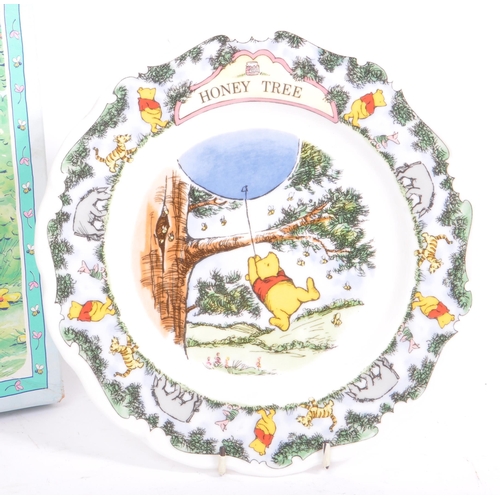 97 - Disney - A retro 1980's Royal Doulton ceramic Winnie the Pooh wall clock & two ceramic plates. From ... 