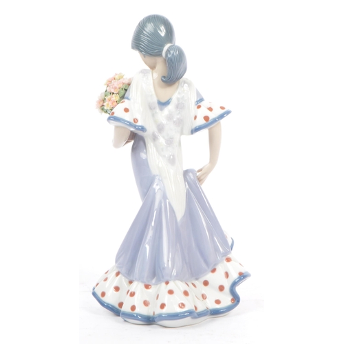 98 - Lladro - Flora Maria - A late 20th century circa 1980s porcelain china figurine. A Hispanic female h... 