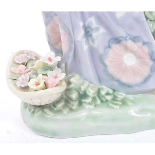 99 - Lladro - Aroma of the Island - A vintage 20th century porcelain china. Measures approx. 24cm tall .