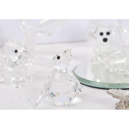 104 - Swarovski Crystal - A collection of glass crystal figures / ornaments. Comprising of mice, frogs, do... 