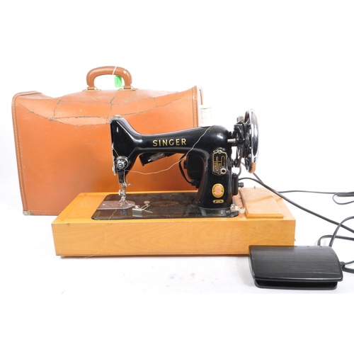 1048 - Singer Sewing Machines. - 99K Model - A vintage mid 20th century Singer sewing machine on wooden bas... 