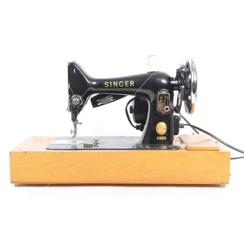 1048 - Singer Sewing Machines. - 99K Model - A vintage mid 20th century Singer sewing machine on wooden bas... 