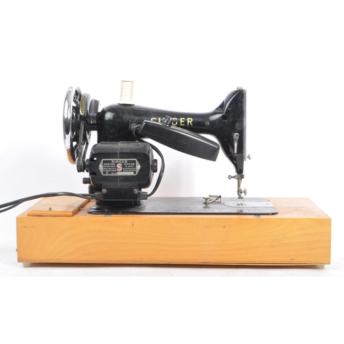 1048 - Singer Sewing Machines. - 99K Model - A vintage mid 20th century Singer sewing machine on wooden bas... 