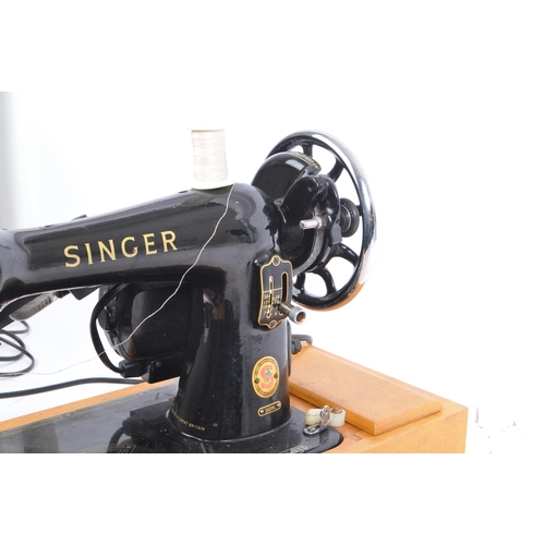 1048 - Singer Sewing Machines. - 99K Model - A vintage mid 20th century Singer sewing machine on wooden bas... 