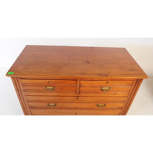 1050 - An early 20th century Edwardian walnut and satinwood chest of drawers. Rectangular form with flared ... 