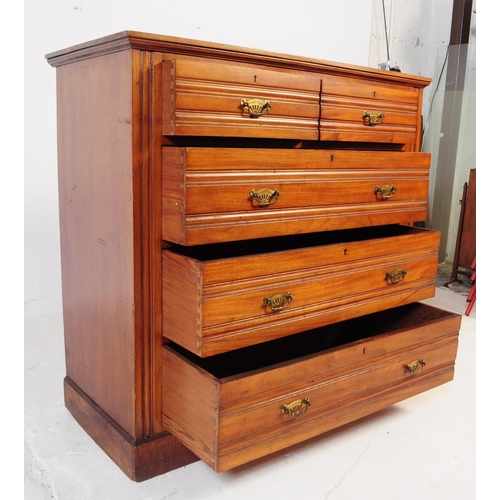 1050 - An early 20th century Edwardian walnut and satinwood chest of drawers. Rectangular form with flared ... 