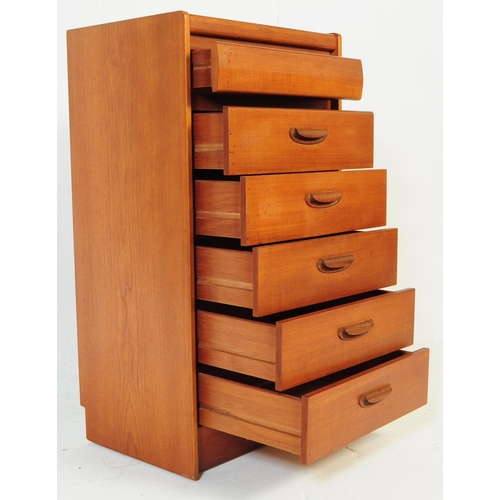 552 - British Modern Design - A retro mid century teak tall boy chest of drawers. Of rectangular form with... 