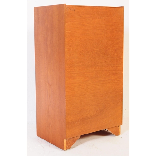 552 - British Modern Design - A retro mid century teak tall boy chest of drawers. Of rectangular form with... 