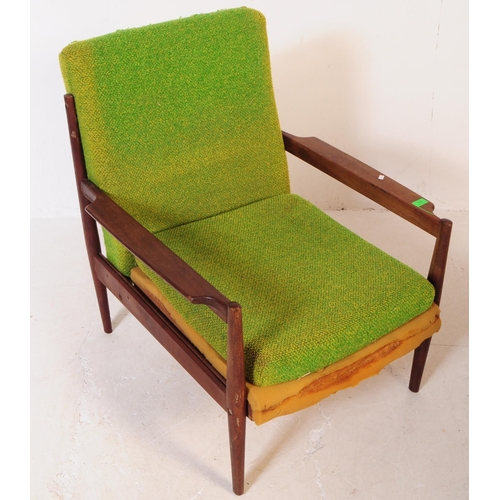 553 - A retro mid 20th century teak low armchair in the manner of Grete Jalk Model. With green fabric drop... 