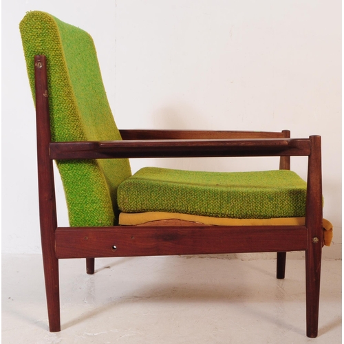 553 - A retro mid 20th century teak low armchair in the manner of Grete Jalk Model. With green fabric drop... 