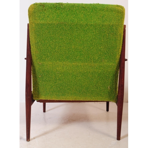 553 - A retro mid 20th century teak low armchair in the manner of Grete Jalk Model. With green fabric drop... 