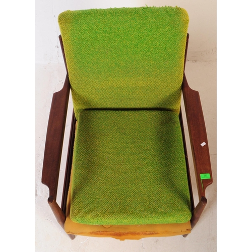 553 - A retro mid 20th century teak low armchair in the manner of Grete Jalk Model. With green fabric drop... 