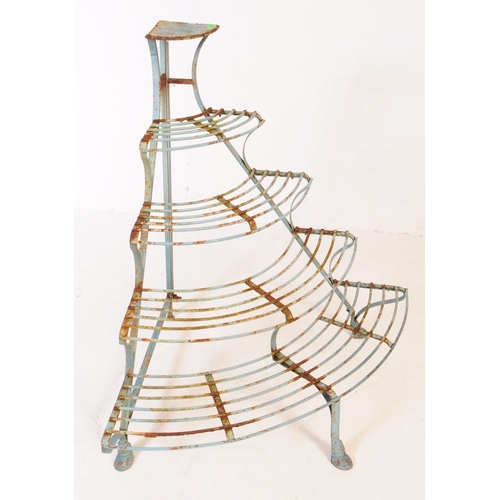 558 - A 20th century French manner painted iron corner plant stand etagere. The stand having four curved s... 