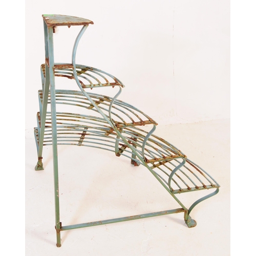 558 - A 20th century French manner painted iron corner plant stand etagere. The stand having four curved s... 