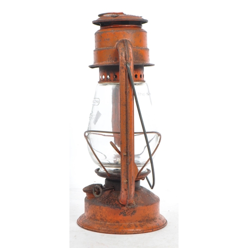 562 - A mid 20th century Chalwyn painted metal miners oil lamp. The lamp of metal construction, with a bul... 