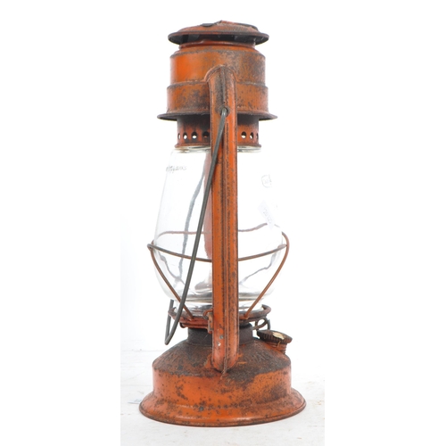 562 - A mid 20th century Chalwyn painted metal miners oil lamp. The lamp of metal construction, with a bul... 