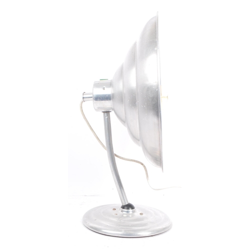 564 - A mid 20th century Estawa chromed metal circular wall lamp. The lamp having an oversized circular me... 