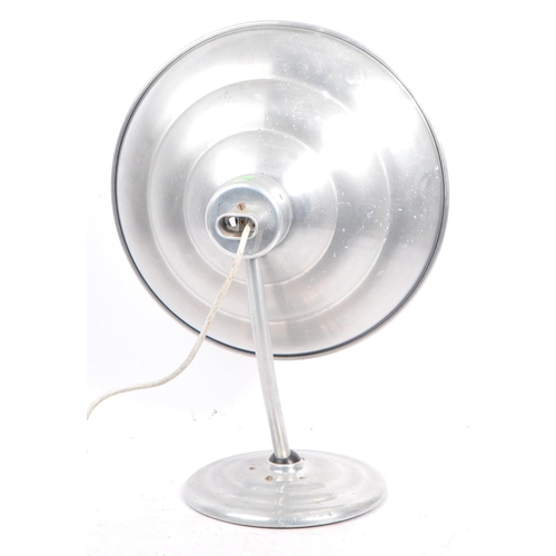 564 - A mid 20th century Estawa chromed metal circular wall lamp. The lamp having an oversized circular me... 