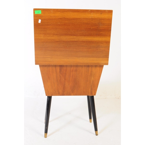 571 - A retro mid 20th century teak veneered sex table / box. Rectangular form hinged lid with contents on... 