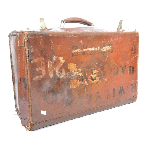 576 - A 20th century leather bound military suitcase trunk. The case of rectangular form, with brass latch... 