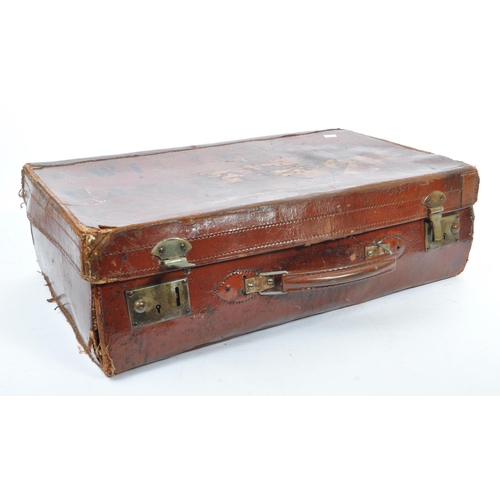 576 - A 20th century leather bound military suitcase trunk. The case of rectangular form, with brass latch... 