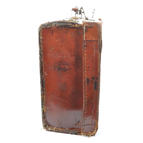 576 - A 20th century leather bound military suitcase trunk. The case of rectangular form, with brass latch... 