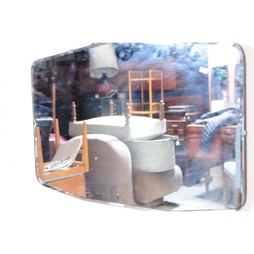 577 - A 20th century circa 1930s Art Deco manner frameless wall mirror. Having a large central glass mirro... 