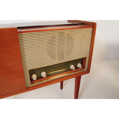 578 - A retro mid 20th century teak radiogram / stereogram. Rectangular form with smoked plastic top, radi... 