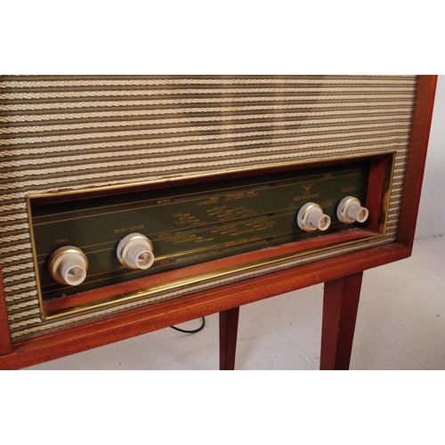 578 - A retro mid 20th century teak radiogram / stereogram. Rectangular form with smoked plastic top, radi... 