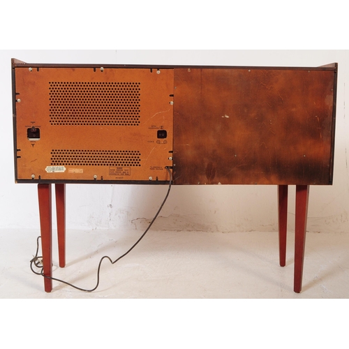 578 - A retro mid 20th century teak radiogram / stereogram. Rectangular form with smoked plastic top, radi... 