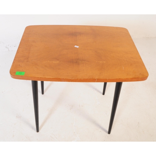 580 - A vintage 20th century walnut veneered occasional / coffee table. Of rectangular curved form with ta... 