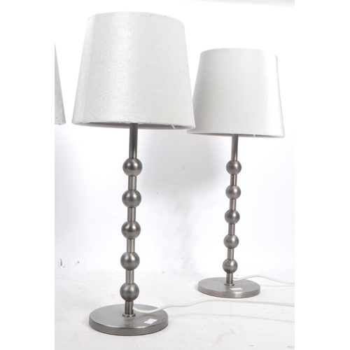 582 - A collection of four contemporary pewter ball side table / desk lamps. Each lamp featuring a central... 