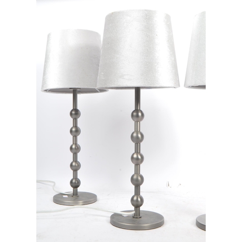 582 - A collection of four contemporary pewter ball side table / desk lamps. Each lamp featuring a central... 