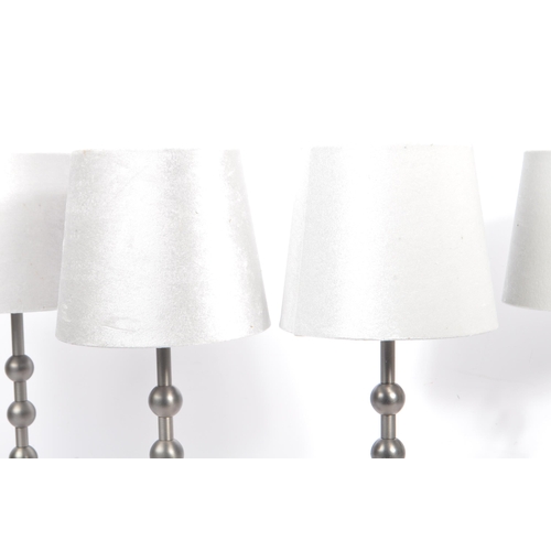 582 - A collection of four contemporary pewter ball side table / desk lamps. Each lamp featuring a central... 