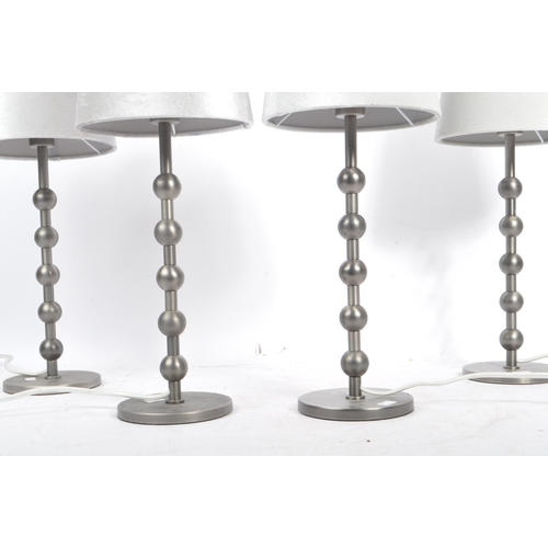 582 - A collection of four contemporary pewter ball side table / desk lamps. Each lamp featuring a central... 