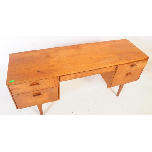 583 - Beithcraft Furniture - A mid 20th century teak writing office / school desk table. Rectangular form ... 