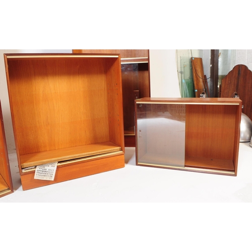 585 - Minty Furniture - A retro mid 20th century teak assortment / modular system of book cases / cabinet.... 