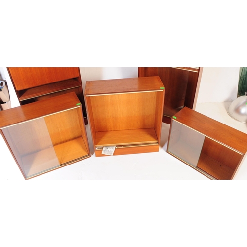 585 - Minty Furniture - A retro mid 20th century teak assortment / modular system of book cases / cabinet.... 