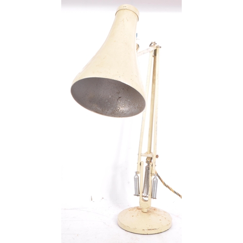 586 - A mid 20th century Herbert Terry manner anglepoise articulated desk lamp. The lamp having a white pa... 