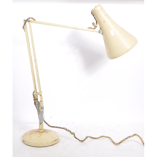 586 - A mid 20th century Herbert Terry manner anglepoise articulated desk lamp. The lamp having a white pa... 