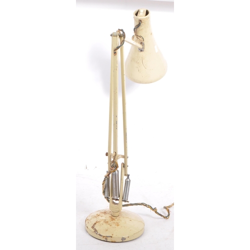 586 - A mid 20th century Herbert Terry manner anglepoise articulated desk lamp. The lamp having a white pa... 