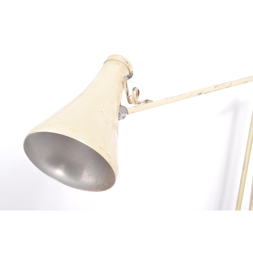 586 - A mid 20th century Herbert Terry manner anglepoise articulated desk lamp. The lamp having a white pa... 