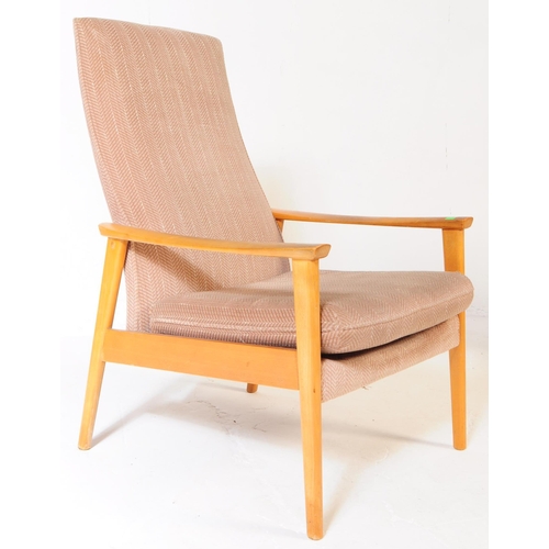 592 - Manner of Parker Knoll - a matching pair of Mid-century retro armchairs / lounge chairs raised on be... 