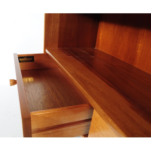 593 - Nathan - A retro mid 20th century circa. 1970's Nathan teak bookcase cabinet having a shelf over two... 