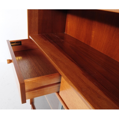 593 - Nathan - A retro mid 20th century circa. 1970's Nathan teak bookcase cabinet having a shelf over two... 