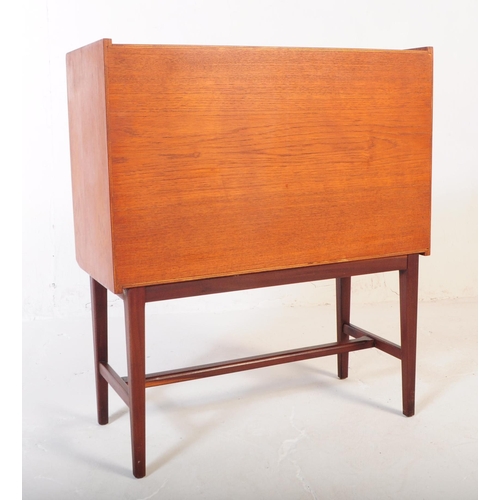 597 - A retro mid 20th Century teak sideboard credenza cabinet of small proportions.  Having cupboard stor... 