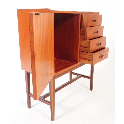 597 - A retro mid 20th Century teak sideboard credenza cabinet of small proportions.  Having cupboard stor... 